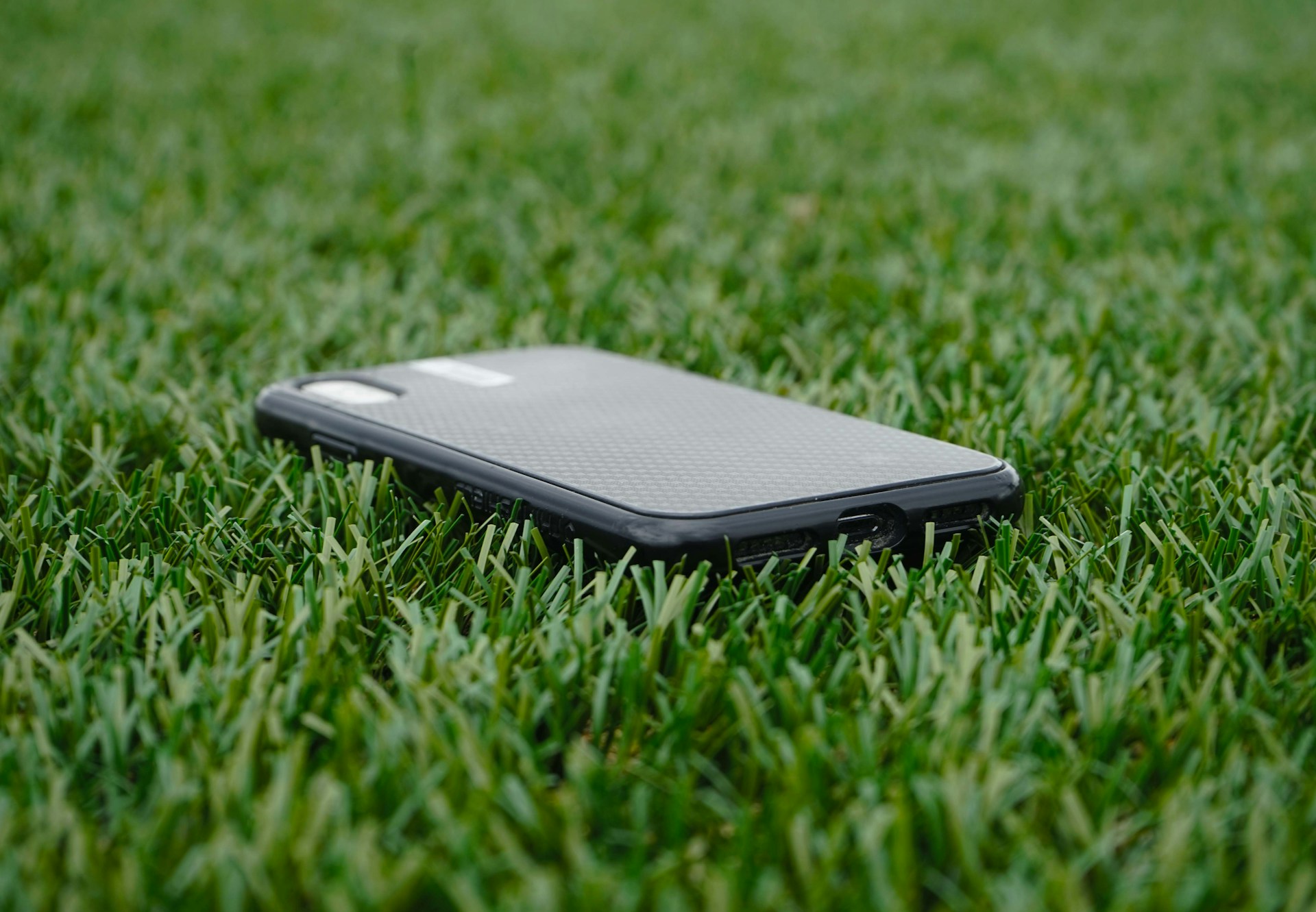 Phone on golf course grass