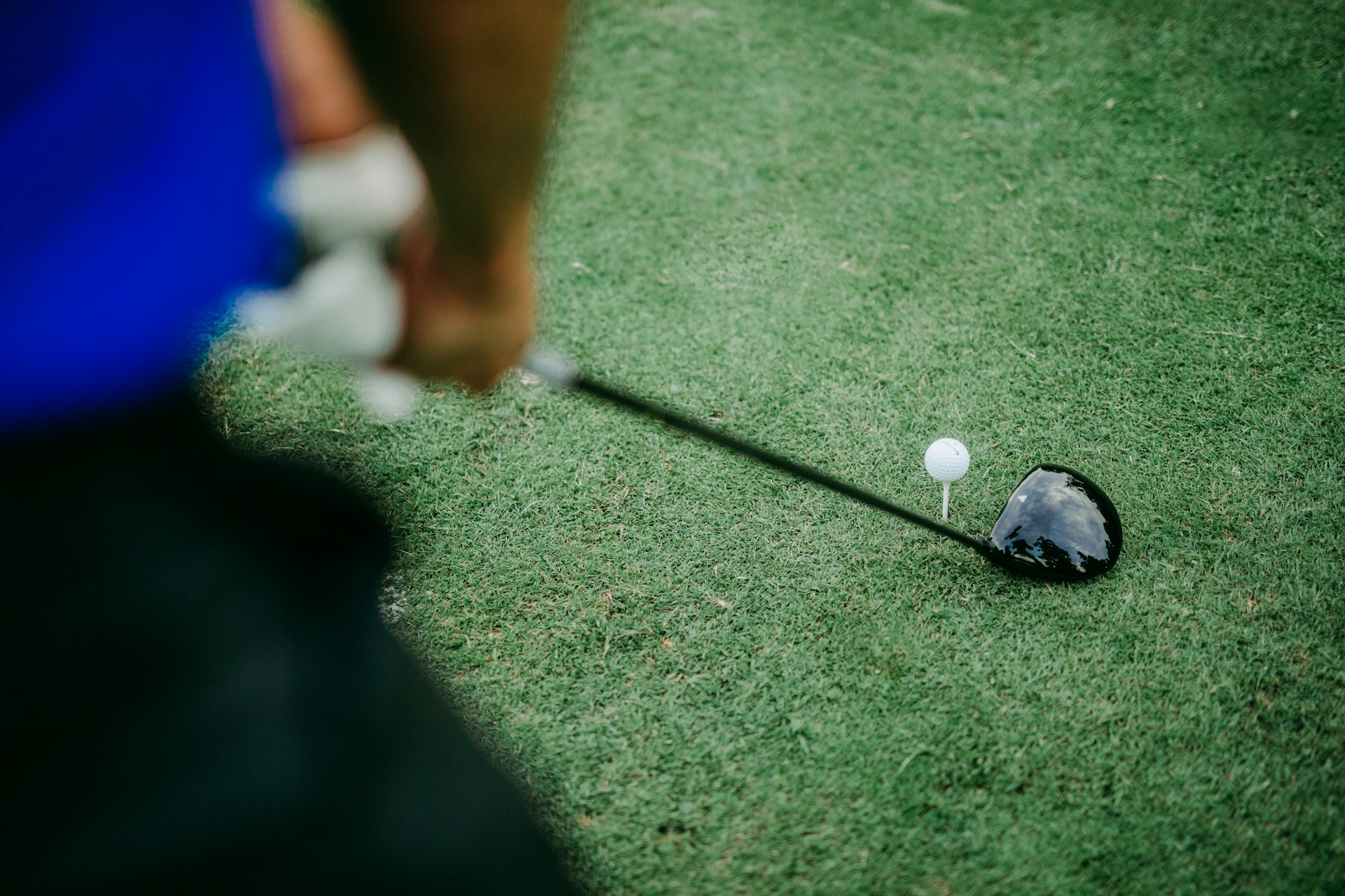 Driver head and golf ball on tee